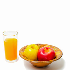 Apple juice in a glass and baked apples