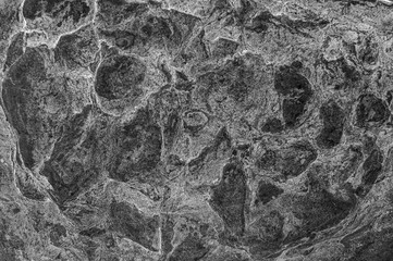 Fototapeta na wymiar Texture pattern. Stone texture. Stone old wall. Granite natural surface. Natural stone close-up. Structural surface close-up.