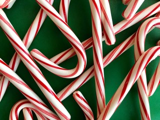 christmas candy canes on green background