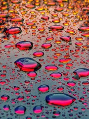 drops of water on red background