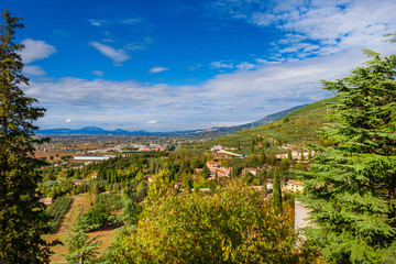 View of Umbria countryside with the ancient town of Assisi from the Spello panoramic terrace