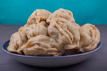 Delicious mantas on a plate on gray background