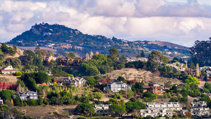 Fototapeta na wymiar Aerial view of residential neighborhood with scattered houses build on hill slopes, Mill Valley, North San Francisco Bay Area, California