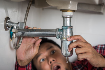 clogged and leaky sink sewer