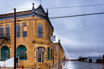 Beautiful limestone buildings  from the late 1880s still form the core of rural downtown Jetmore, Kansas.