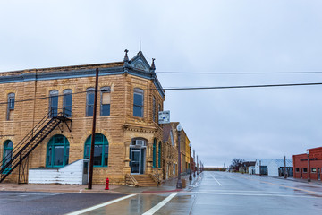 Beautiful limestone buildings  from the late 1880s still form the core of rural downtown Jetmore, Kansas.