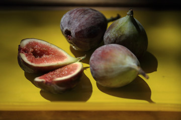 fresh figs on yellow plate