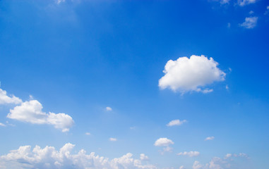 Naklejka na ściany i meble Blue sky background and white clouds soft focus, and copy space