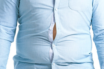 Overweight man in tight clothes, closeup. Weight loss concept