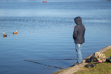 Naklejka premium The fisherman is fishing. Sports equipment fishing rod