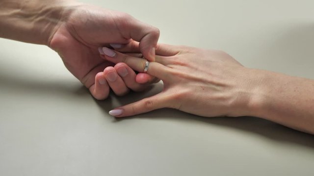 Man put on engagement ring with diamond on woman finger. Proposal. Romantic moment 4k