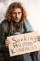 Portrait of poor homeless man outdoors
