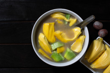Sweet food in a dark wooden cup