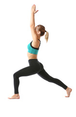 Fototapeta premium Beautiful young woman practicing yoga on white background