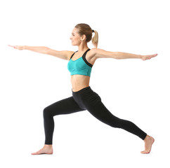 Beautiful young woman practicing yoga on white background