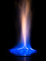 A fiery flame on a black background