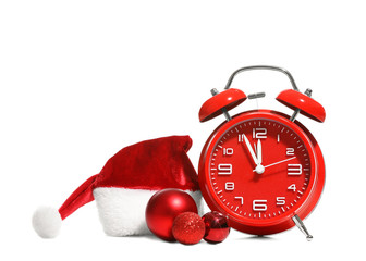 Alarm clock, decor and Santa hat on white background. Christmas countdown concept