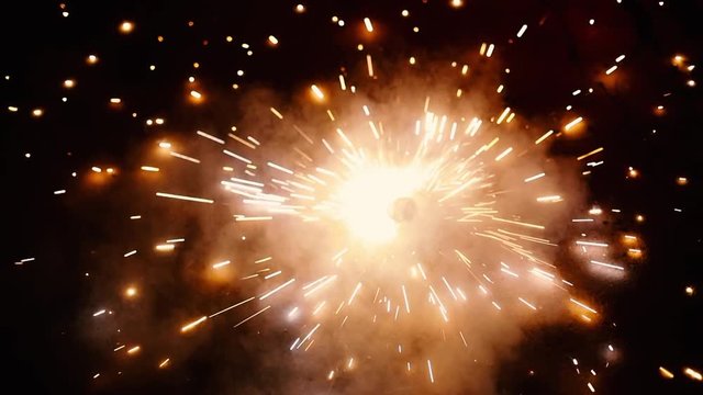 Cracker sparkles spinning isolated on a black background