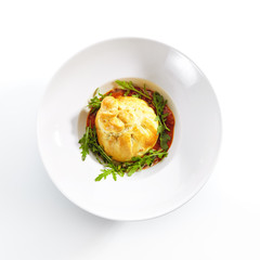 Baked Burrata Cheese with Tomato Sauce and Fresh Arugula Leaves Top View
