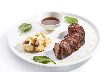 Beef steak with cauliflower dish top view
