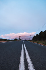 Asphalt road in Tasmania during sunset