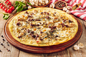 Mushroom pizza on wooden table close up