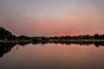 dawn in the park with bush fire haze