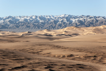 Gobi Desert Singing Sand Dunes mountain at background