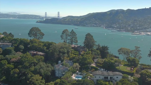 Aerial: Town Of Tiburon in Marin with a view out to the Golden Gate bridge, San Francisco, USA