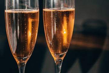 Happy New Year concept, two glasses of champagne on black background. Merry christmas.
