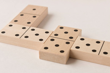 Playing dominoes on a white background. Leisure games concept. Domino effect.