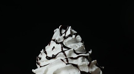 Close up Whip cream on Cocoa smoothie Black background, Food concept Front view.