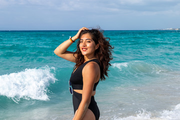 Young woman posing on the beach