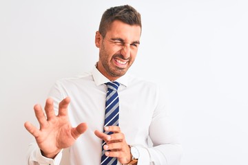 Young handsome elegant business man over isolated background disgusted expression, displeased and fearful doing disgust face because aversion reaction. With hands raised. Annoying concept.