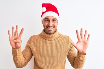 Young handsome man wearing christmas and turtleneck sweater over isolated background showing and pointing up with fingers number nine while smiling confident and happy.