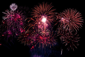 Colorful fireworks festivals on black background.