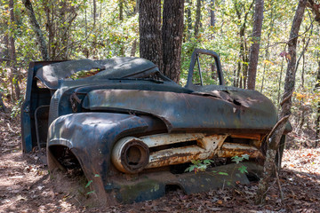 abandoned car in the forest