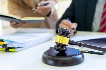 Judge or lawyer talking  with team