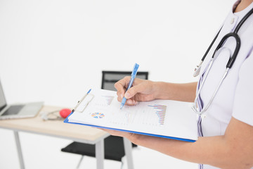 successful doctor takes notes on a notepad