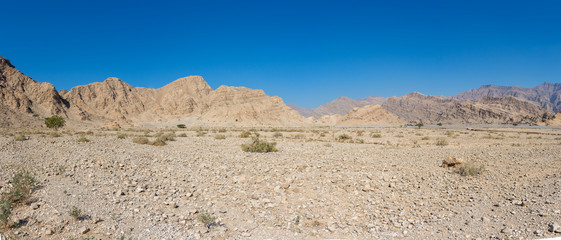 Panorama of Jebal Jais Mountain area in Ras al Khaimah, United Arab Emirates on a beautiful sunny day with blue sky