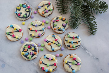Traditional home made Christmas Lights Cookies on a festive christmas background