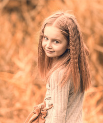 cute little girl is walking in summer