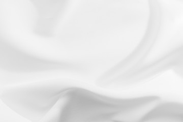 Abstract white fabric texture background. Cloth soft wave. Creases of satin, silk, and cotton.