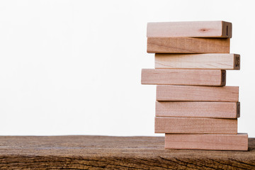 blocks wood on wooded floor white background. picture for add text or graphic design.