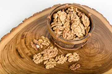 Walnut kernels on wooden slab