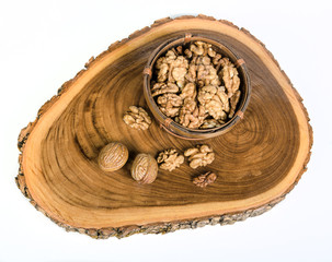 Walnut kernels on wooden slab