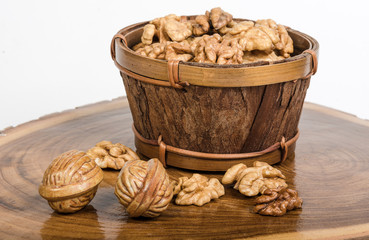 Walnut kernels on wooden slab