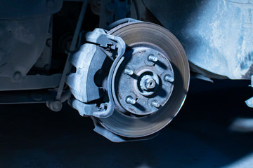 Caliper and brake disc of the front wheel of the car.