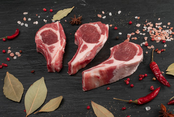 Raw Lamb Chops, Mutton Cuts or Sheep Ribs on Black