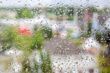 Water or rain in front of mirror of window or door.